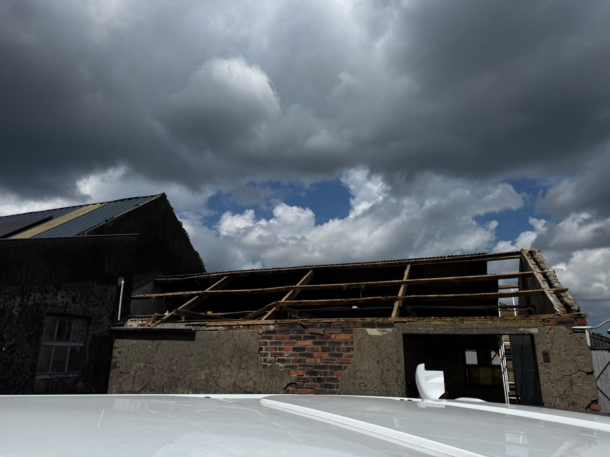 Barn roof partly dismantled during demolition works in Anglesey