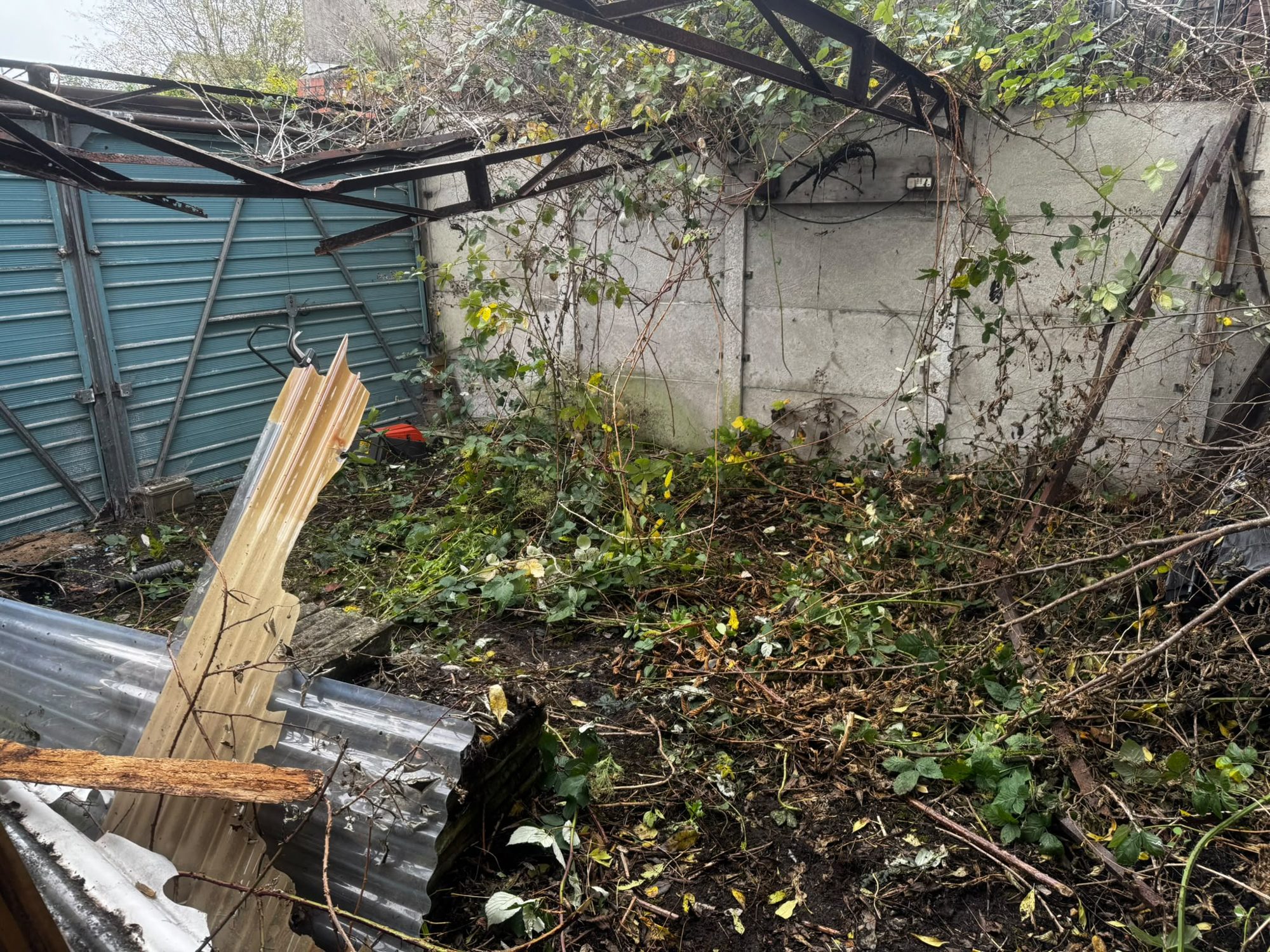 Corrugated asbestos cement roof sheets awaiting removal in North Wales