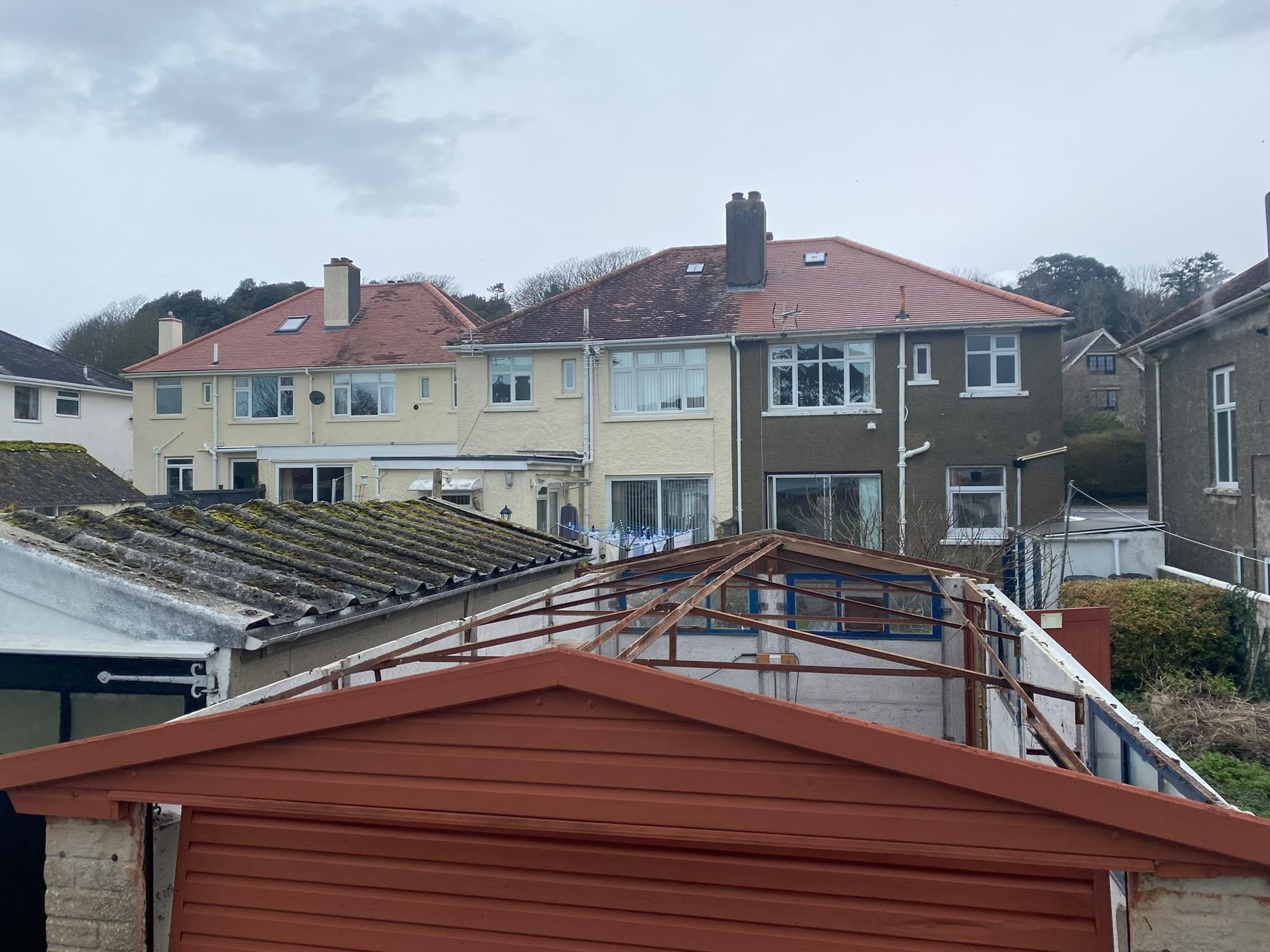 Garage roof framework after asbestos cement sheets removed in North Wales