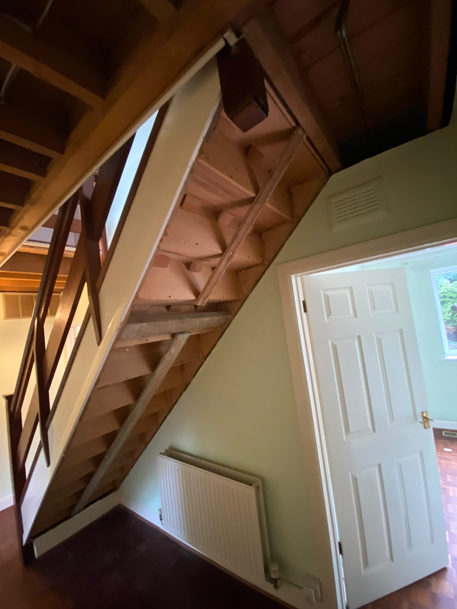Staircase soffit stripped out during soft strip works in Anglesey